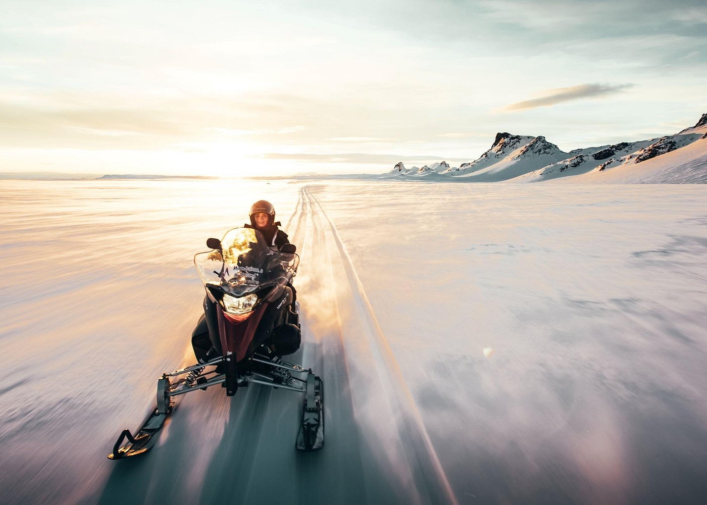 Snowmobile travellers crossing the highland landscape near Langjökull Glacier
